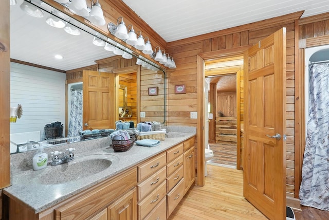 1880 Clydeton Rd, Waverly, TN 37185 - bathroom with wooden walls, double vanity, wood-type flooring, and crown molding