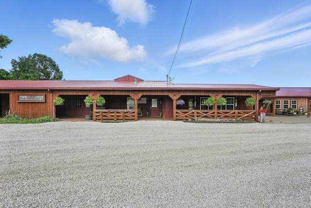 1880 Clydeton Rd, Waverly, TN 37185 - view of front facade with a metal roof, an exterior structure, and an outbuilding