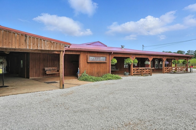 1880 Clydeton Rd, Waverly, TN 37185 - view of front of home with an exterior structure, a metal roof, and an outdoor structure