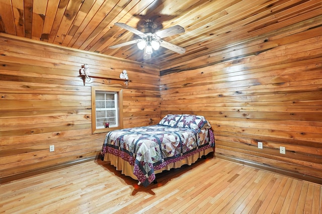 1880 Clydeton Rd, Waverly, TN 37185 - bedroom with wooden ceiling, hardwood / wood-style floors, wooden walls, and a ceiling fan