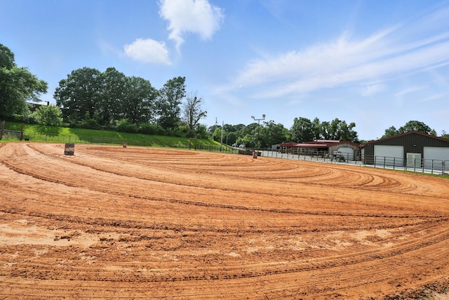 1880 Clydeton Rd, Waverly, TN 37185 - view of yard featuring an outdoor riding arena, a detached garage, a pole building, driveway, and an outbuilding