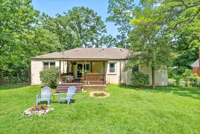 1207 Trotwood Ave, Columbia, TN 38401 - back of house with an outdoor fire pit and a wooden deck