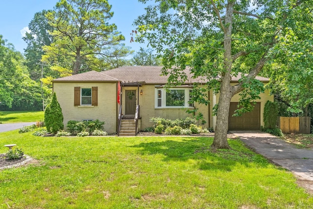 1207 Trotwood Ave, Columbia, TN 38401 - view of front of home with an attached garage, driveway, and roof with shingles