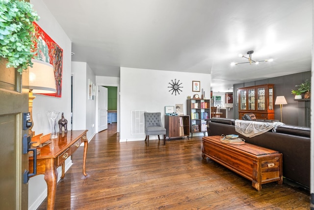 1207 Trotwood Ave, Columbia, TN 38401 - living room featuring wood finished floors and a chandelier