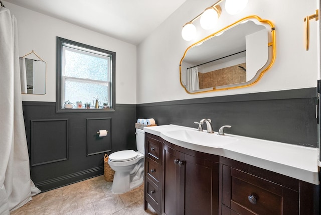 1207 Trotwood Ave, Columbia, TN 38401 - bathroom with wainscoting, vanity, and a shower with curtain
