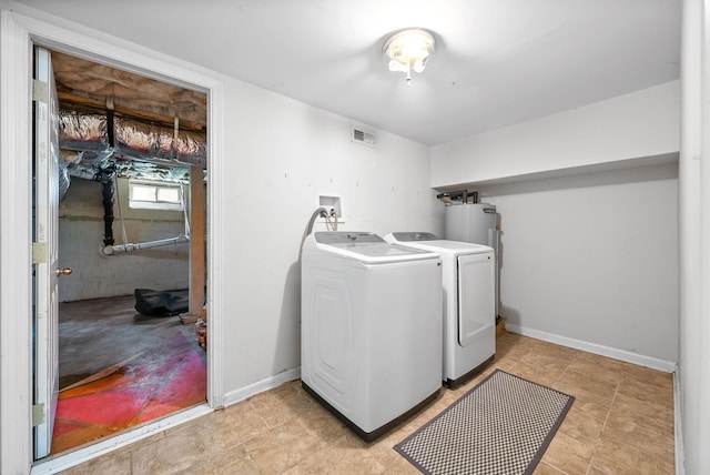 1207 Trotwood Ave, Columbia, TN 38401 - laundry room with washing machine and dryer and electric water heater