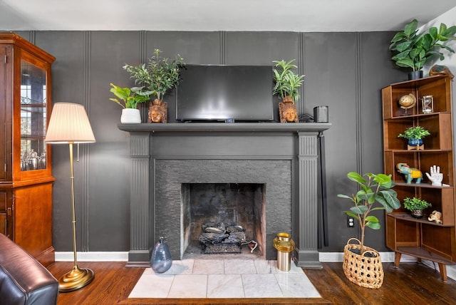 1207 Trotwood Ave, Columbia, TN 38401 - detailed view of wood finished floors, a decorative wall, and a fireplace with flush hearth
