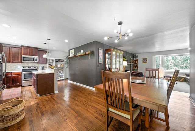 1207 Trotwood Ave, Columbia, TN 38401 - dining space with dark wood-style flooring, a chandelier, and recessed lighting