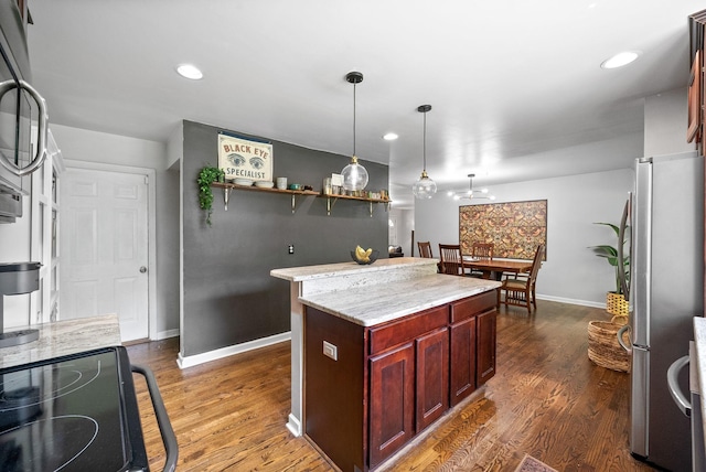 1207 Trotwood Ave, Columbia, TN 38401 - kitchen with freestanding refrigerator, dark brown cabinets, dark wood-type flooring, black / electric stove, and recessed lighting