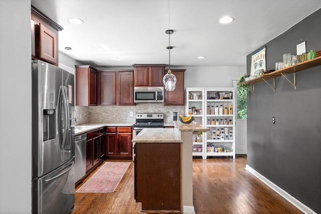 1207 Trotwood Ave, Columbia, TN 38401 - kitchen featuring stainless steel appliances, dark wood finished floors, decorative backsplash, light stone counters, and recessed lighting
