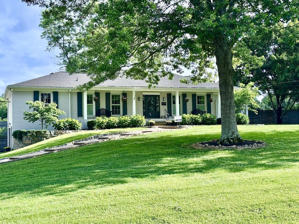 109 Poplar St, Franklin, TN 37064 - single story home with a front yard and a porch