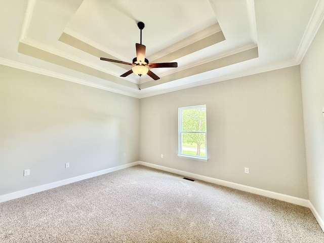 65 Misty Ln, Castalian Springs, TN 37031 - spare room with a tray ceiling, crown molding, light colored carpet, and a ceiling fan