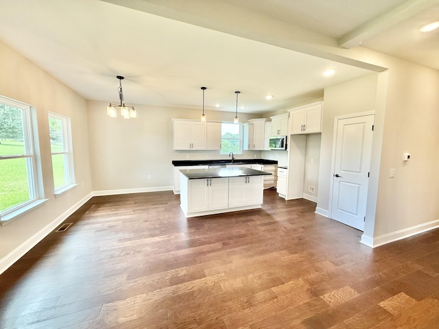 65 Misty Ln, Castalian Springs, TN 37031 - kitchen featuring plenty of natural light, dark countertops, dark wood-style floors, white cabinetry, and recessed lighting