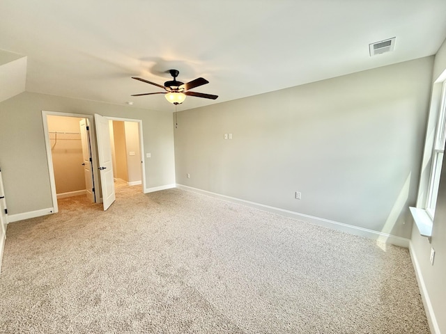 65 Misty Ln, Castalian Springs, TN 37031 - unfurnished bedroom featuring light carpet, a spacious closet, a ceiling fan, and a closet