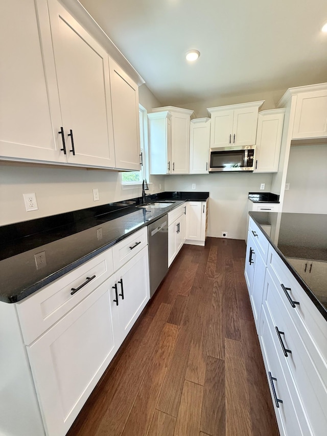 65 Misty Ln, Castalian Springs, TN 37031 - kitchen featuring appliances with stainless steel finishes, dark wood finished floors, white cabinets, dark stone counters, and recessed lighting