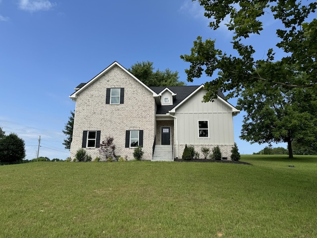 65 Misty Ln, Castalian Springs, TN 37031 - view of front of house with board and batten siding, a front yard, and brick siding