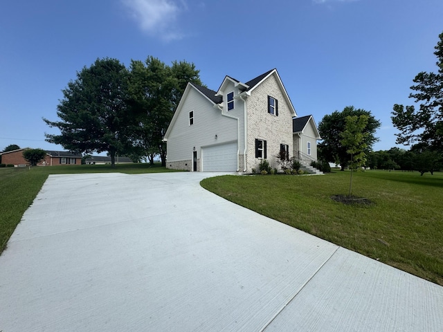 65 Misty Ln, Castalian Springs, TN 37031 - view of property exterior with driveway, a garage, a lawn, and brick siding