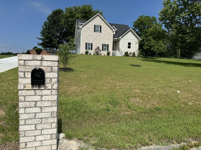 65 Misty Ln, Castalian Springs, TN 37031 - traditional-style house featuring board and batten siding and a front lawn