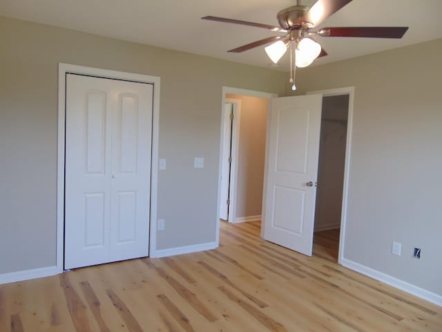 369 Brace Loop, Summertown, TN 38483 - unfurnished bedroom featuring light wood-style flooring, a closet, and a ceiling fan