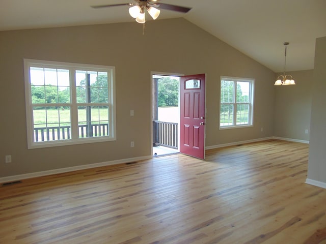 369 Brace Loop, Summertown, TN 38483 - unfurnished living room featuring ceiling fan, a chandelier, lofted ceiling, and light wood-type flooring