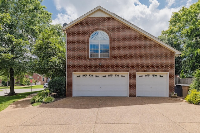 101 Portsmouth Cv, Brentwood, TN 37027 - view of property exterior with brick siding, a garage, and driveway