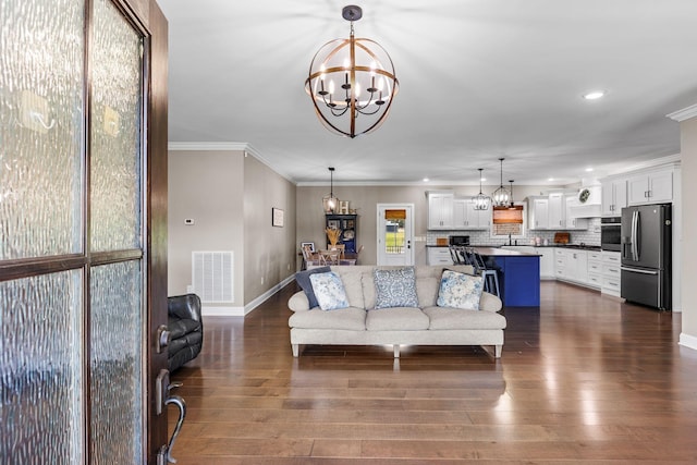 268 Planters Cir, Leoma, TN 38468 - living area with a chandelier, dark wood-type flooring, recessed lighting, and crown molding