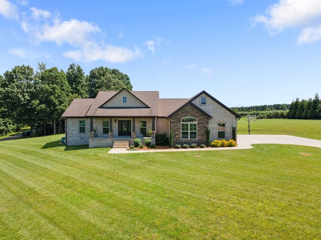 268 Planters Cir, Leoma, TN 38468 - craftsman-style house with covered porch, a front lawn, and brick siding
