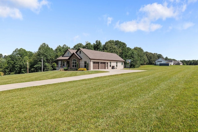 268 Planters Cir, Leoma, TN 38468 - view of front facade featuring concrete driveway, a front lawn, a garage, and brick siding