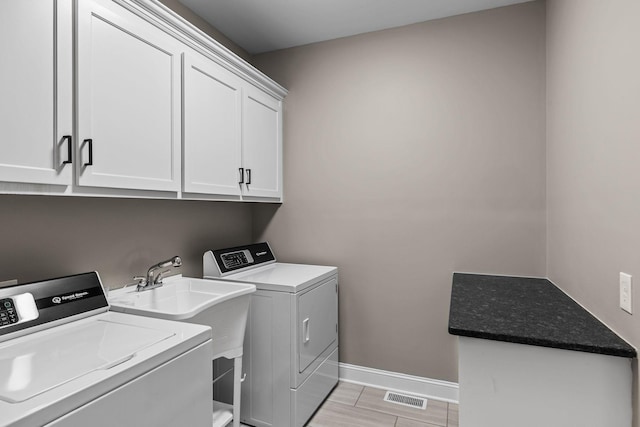 268 Planters Cir, Leoma, TN 38468 - washroom featuring washing machine and dryer and cabinet space