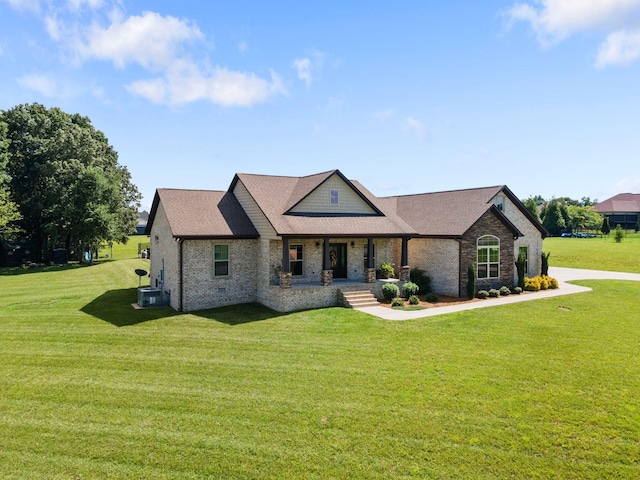 268 Planters Cir, Leoma, TN 38468 - view of front of property featuring covered porch, brick siding, and a front lawn
