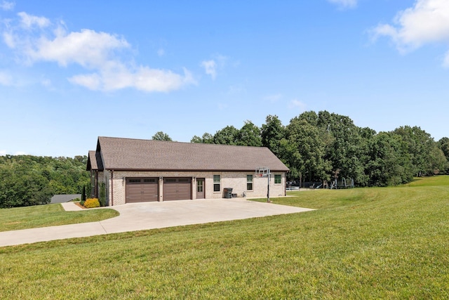 268 Planters Cir, Leoma, TN 38468 - view of front of house featuring a garage, a front yard, brick siding, driveway, and roof with shingles