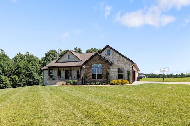 268 Planters Cir, Leoma, TN 38468 - craftsman house with a front lawn, covered porch, driveway, and brick siding