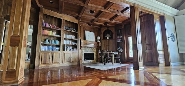 395 Allen Rd, Goodlettsville, TN 37072 - living area with a wood ceiling with exposed beams, wooden walls, a fireplace, built in shelves, and coffered ceiling