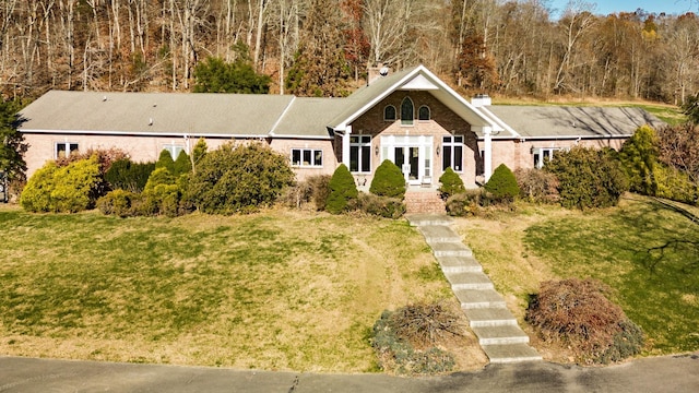 395 Allen Rd, Goodlettsville, TN 37072 - view of front of house with a chimney, a front yard, and brick siding