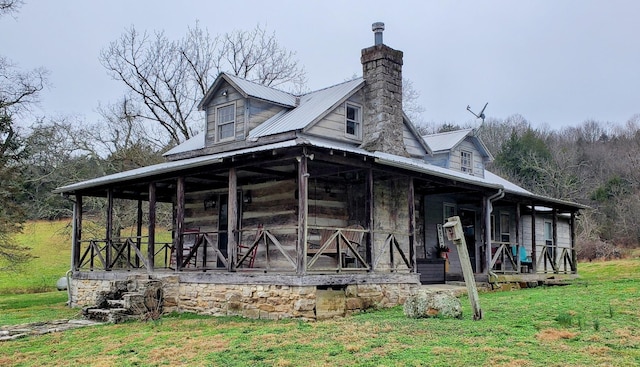 395 Allen Rd, Goodlettsville, TN 37072 - view of front facade with a metal roof, a chimney, and a front yard