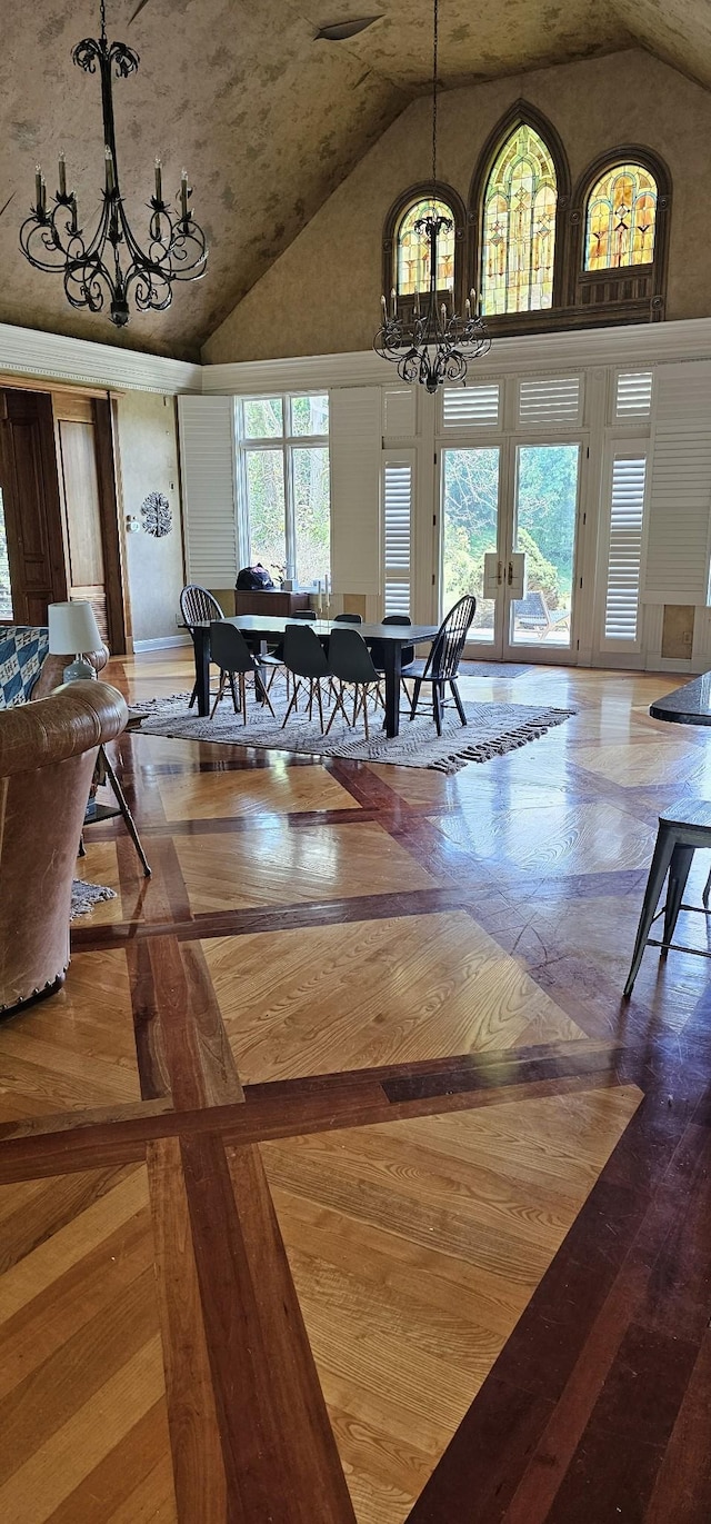 395 Allen Rd, Goodlettsville, TN 37072 - dining space with a chandelier, high vaulted ceiling, plenty of natural light, and french doors
