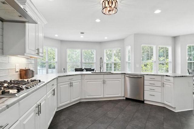 1069 Pleasant Valley Rd, Greenbrier, TN 37073 - kitchen featuring appliances with stainless steel finishes, extractor fan, recessed lighting, decorative backsplash, and white cabinets
