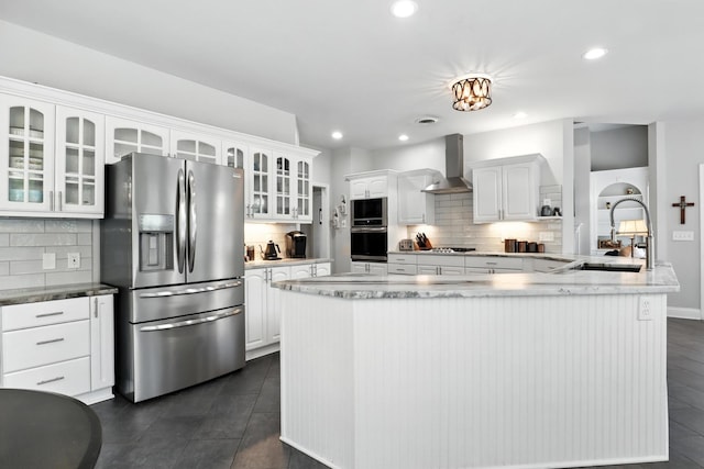 1069 Pleasant Valley Rd, Greenbrier, TN 37073 - kitchen with stainless steel appliances, wall chimney exhaust hood, glass insert cabinets, white cabinets, and tasteful backsplash