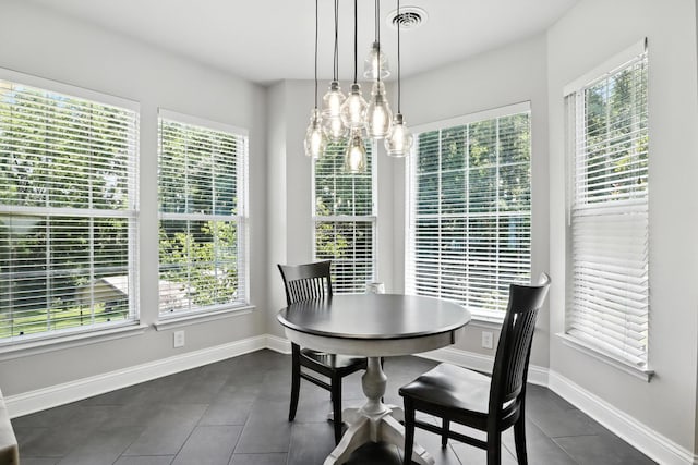 1069 Pleasant Valley Rd, Greenbrier, TN 37073 - dining area with dark tile patterned flooring and a chandelier