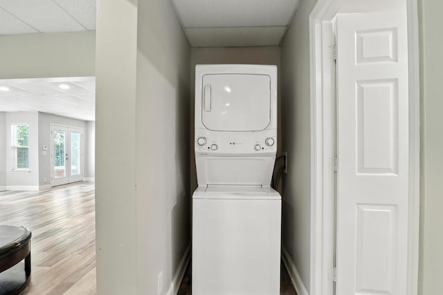1069 Pleasant Valley Rd, Greenbrier, TN 37073 - laundry room with stacked washing machine and dryer and wood finished floors