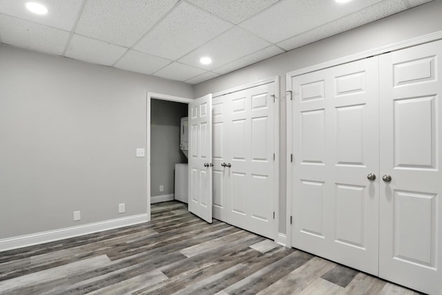 1069 Pleasant Valley Rd, Greenbrier, TN 37073 - unfurnished bedroom featuring two closets, wood finished floors, recessed lighting, and a drop ceiling
