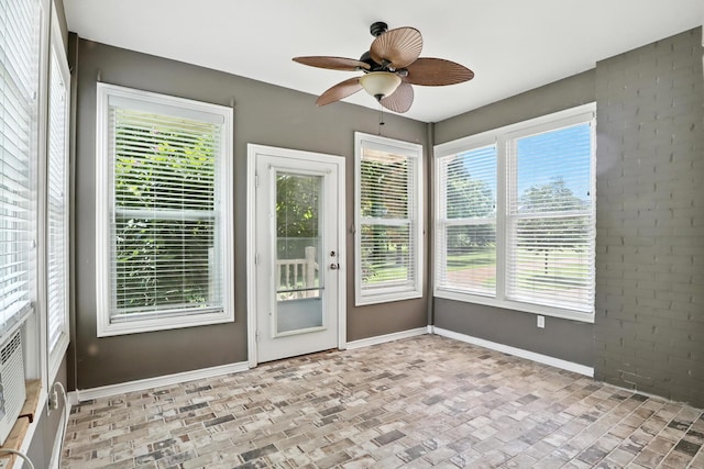 1069 Pleasant Valley Rd, Greenbrier, TN 37073 - unfurnished sunroom featuring brick patterned flooring