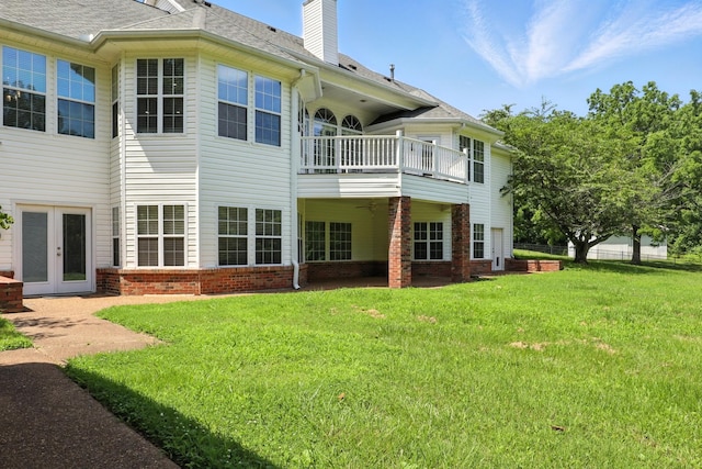 1069 Pleasant Valley Rd, Greenbrier, TN 37073 - rear view of house with a lawn, a balcony, a chimney, and roof with shingles