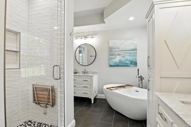 1069 Pleasant Valley Rd, Greenbrier, TN 37073 - full bath with vanity, tile patterned floors, a stall shower, and a soaking tub