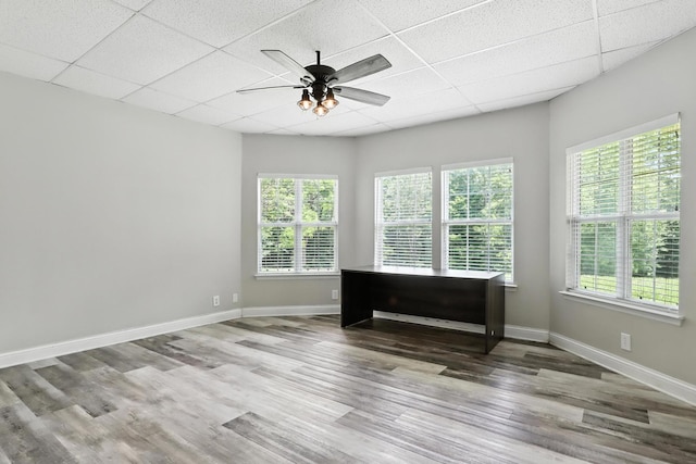 1069 Pleasant Valley Rd, Greenbrier, TN 37073 - empty room featuring a drop ceiling, a ceiling fan, plenty of natural light, and wood finished floors