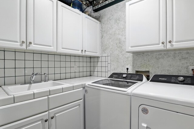 1069 Pleasant Valley Rd, Greenbrier, TN 37073 - laundry room with cabinet space and washer and clothes dryer