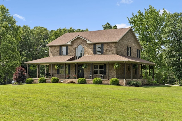 4255 Mcfall Rd, Cumberland City, TN 37050 - farmhouse featuring a porch, a front lawn, brick siding, and a shingled roof