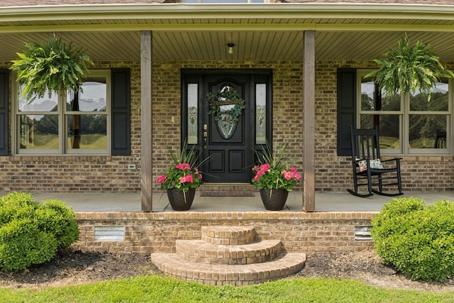 4255 Mcfall Rd, Cumberland City, TN 37050 - property entrance with covered porch and brick siding