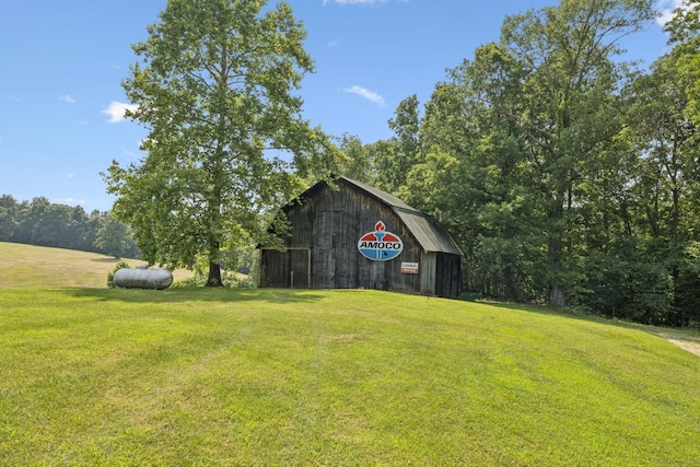 4255 Mcfall Rd, Cumberland City, TN 37050 - view of green lawn with a barn and an outbuilding