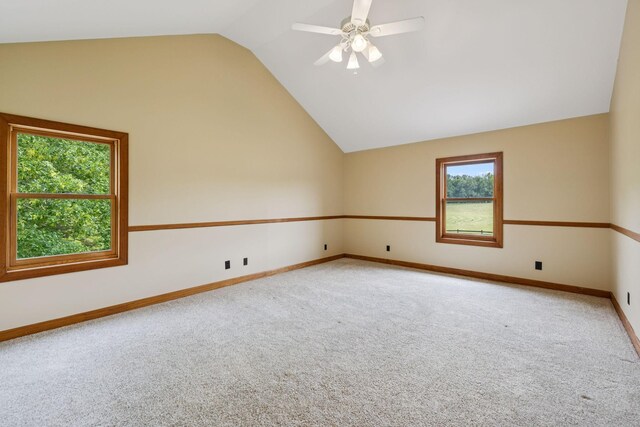 4255 Mcfall Rd, Cumberland City, TN 37050 - bonus room with light colored carpet, vaulted ceiling, plenty of natural light, and a ceiling fan